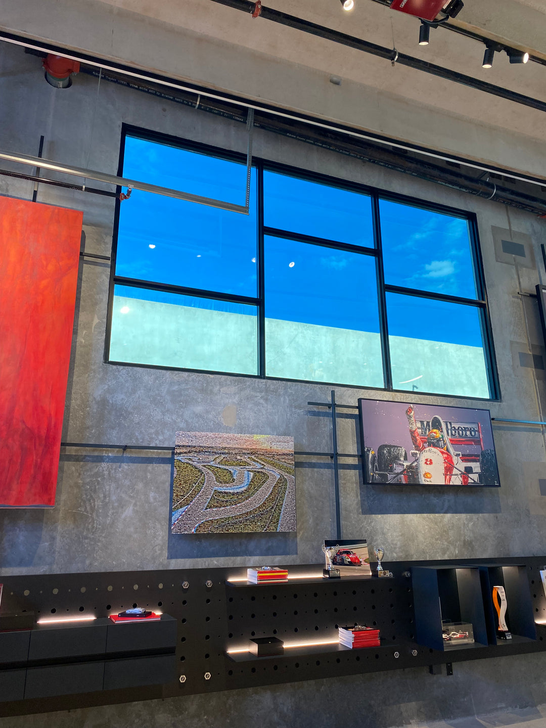 Modern interior with large glass window, artwork on the wall, window tint for security in retail locations for safety