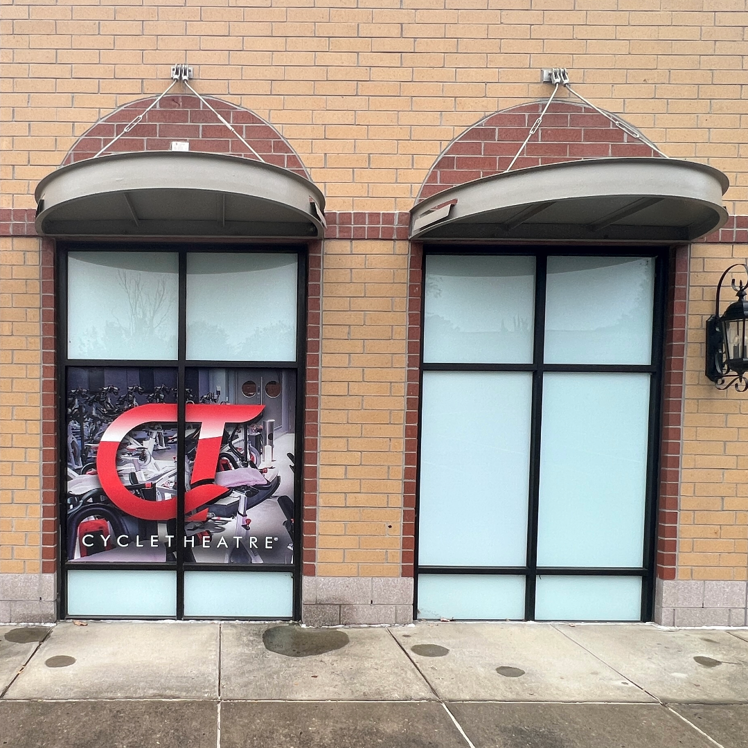 
storefront with large windows and colored window film for blockage and protection
